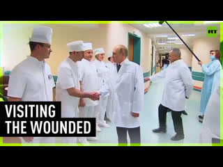 Putin and shoigu visit wounded troops in military hospital