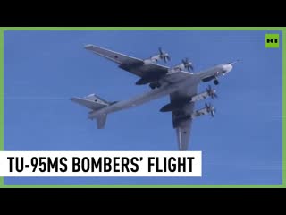 Russian tu 95ms strategic bombers carry out long range flight over bering sea