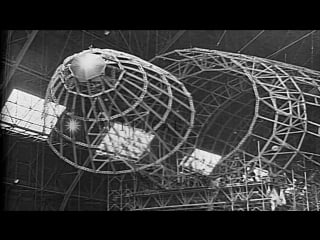 Various frameworks attached together inside a large hanger to make large airship hd stock footage