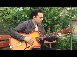 Urban zotel playing lightnin hopkins style blues on an old archtop