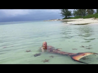 Mermaid melissa with real sea stars on starfish island