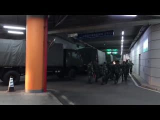 Presence of a large number of chinese paramilitary troops stationed at a sports complex in shenzhen