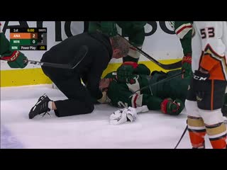 Eric staal down on ice after huge collision with linesman