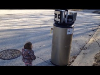 Adorable little girl mistakes broken water heater for a robot