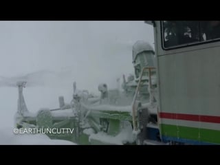 "snow clearing train churns through drifts in japan"