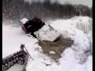 A tractor goes under the ice