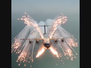 Flares being deployed to attract heat seeking missiles away from the plane
