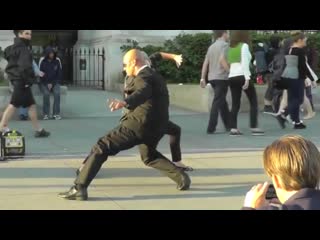 A street vendor selling action "fight scene" shots