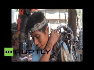 Indonesia partially paralysed bali man creates self made bionic arm