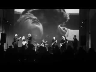 Guitar trio performed by rhys chatham, lee ranaldo, karen haglof, jonathan kane, jon kessler, robert longo, keanu reeves,elliot