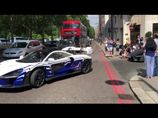 Four mclaren sennas driving through london, including chassis