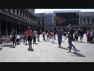 Here some young russians strolling through europe venice, showing what they learn from ver