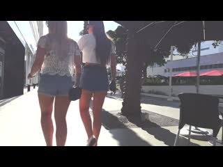 Candid voyeur blond and brunette duo in short shorts
