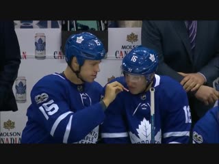 Hockey players sharing smelling salts and a special moment