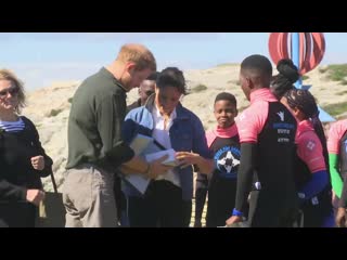 The duke and duchess of sussex show off their dance moves on visit to cape town's monwabisi beach