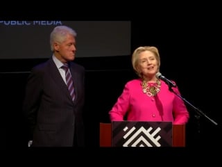 Bill clinton and hillary clinton are presented with a plaque of dr maya angelous inauguration poem