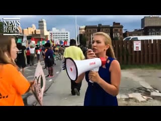 Millie bullhorns climate change protesters at democrat debates