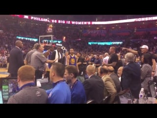 A fan is being asked to cool it by police as he heckles draymond green