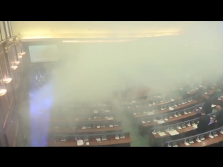 Opposition mps in kosovo release tear gas into parliament to prevent a vote