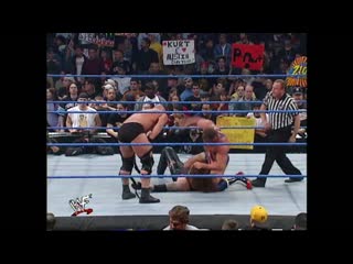 Undertaker vs kurt angle and steve austin ( handicap match )