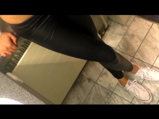 Hot girl in sexy shiny tight leggings red nails