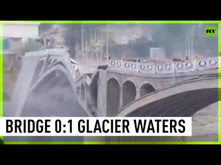 Pakistani hassanabad bridge collapses as melted glacier's water brings floods