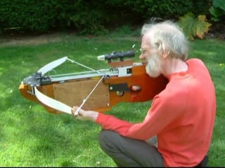 Self cocking electric cross bow