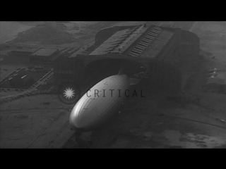 German zeppelin hindenburg (lz 129) is turned and moved tail first into a hangar hd stock footage