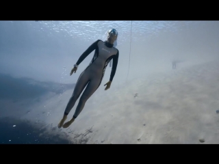 Freediver anna von boetticher swims in dean's blue hole, bahamas