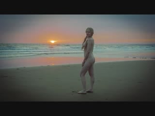 Nude at deserted stormy beach
