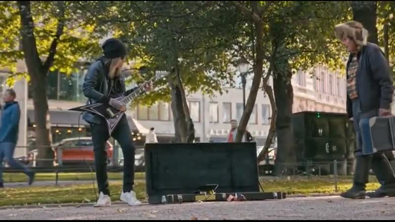 Alexi laiho playing guitar on the street