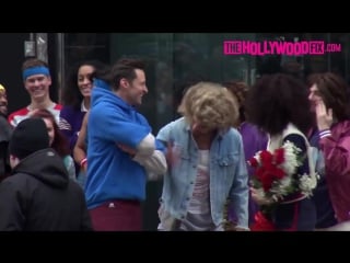 Zac efron zendaya coleman jump on top of a cab while filming a skit with james corden in ny