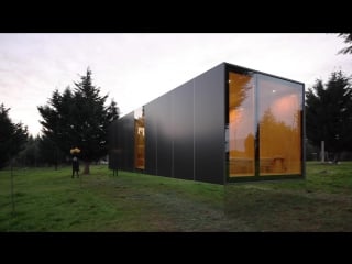 Mima light is a small prefabricated house raised up from the landscape on a near invisible base