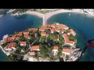 Over saint stephen in budva paragliding montenegro