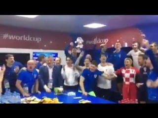 Croatian president kolinda grabar kitarović celebrates with the rest of the team in the locker room after winning the quarter fi