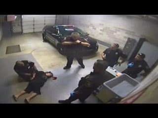 Michigan cop brutally attacks handcuffed woman, knocking her unconscious!