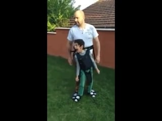 Dad makes device to help his paralyzed son stand