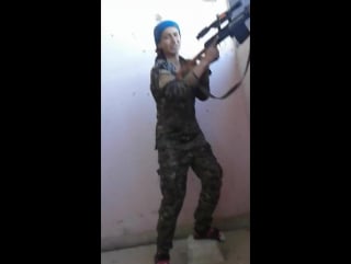 Female kurdish soldier almost gets shot in the head and laughs it off