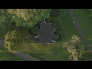 Carme pinós unveils origami inspired mpavilion raised up on grass mounds