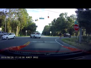 Lady runs a 4 way intersection stop, hits my twin brother on his bike recorded on my older brothers dashcam he’s alive