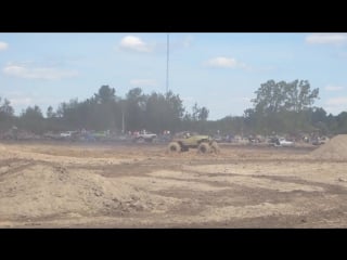 Green buggy freestyle mudding at michigan mud jam 2013 view 3