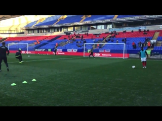 Warm up | the lads are being put through their paces with 15 minutes until kick off