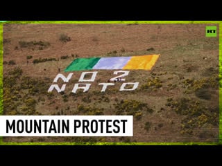 ‘no 2 nato’ activists send message to biden on his arrival in belfast