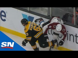 Cale makar leaves game with injury after hard hit from brad marchand