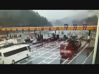 Truck with sidearm takes out toll booth
