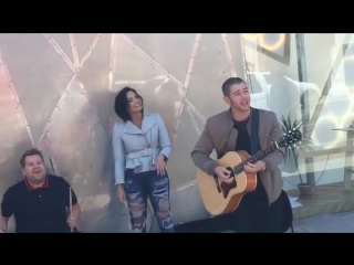 Nick jonas, demi lovato & james corden were on melrose doing an acrostic set