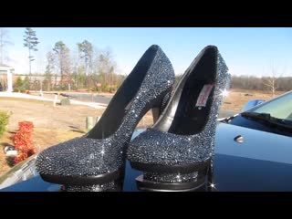 Swarovski crystal encrusted black gianmarco lorenzi heels outside