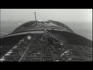 A hanger for uss macon being constructed as men put together steel frame structur hd stock footage