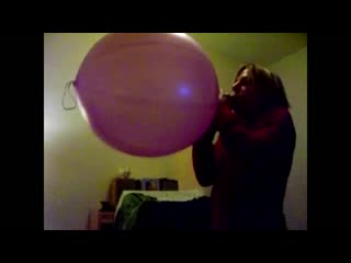 Enormous pink punch balloon got blown to bits by girl