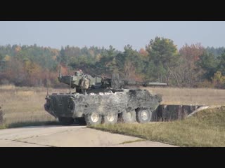 Stryker family in action m1128 mobile gun, m1126 icv 30mm dragoon engage simulated targets